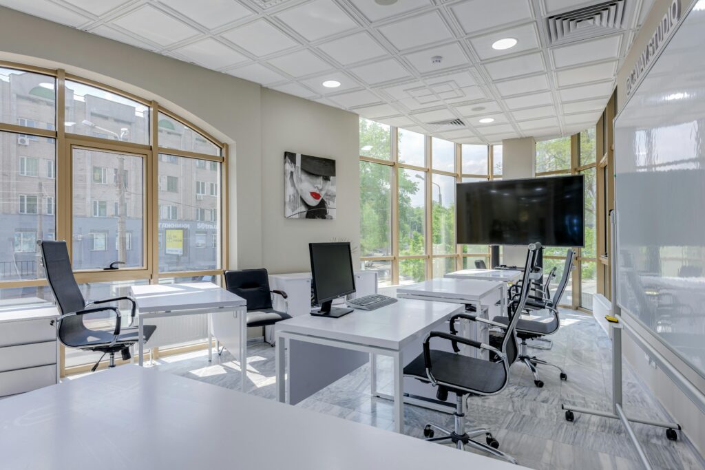 pexels-photo-7750123-7750123 Contemporary minimalist office with glass windows and ergonomic chairs.